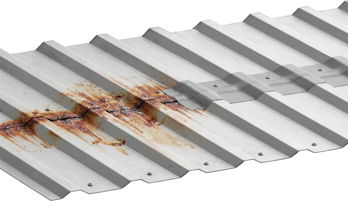 Corrugated metal sheeting with one lap heavily rusted and streaked and the next clean under a sealed band